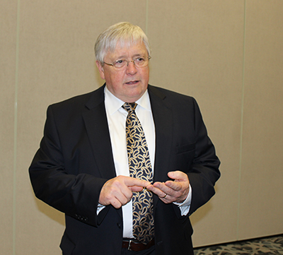 Larry Minnix talks to press at LeadingAge's convention in Dallas