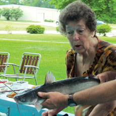 Resident Audrey Higginbotham marvels at a big catch.