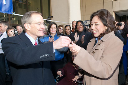 Hilda Solis accepts keys to her new office from Ed Hugler. Photo: Shawn Moore, Dept. of Labor.