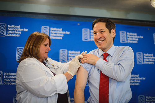 Tom Frieden, M.D., receives his flu shot on Thursday, Sept. 18