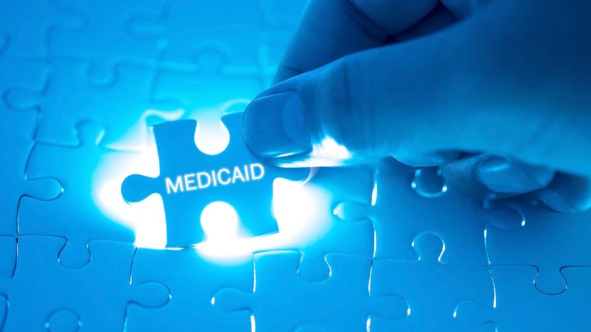 hand placing Medicaid puzzle piece