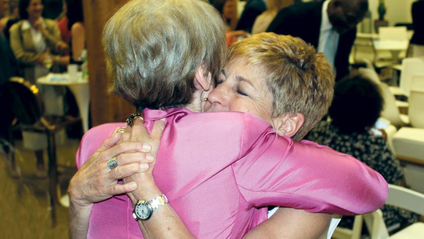 Lynne Katzmann hugs Wendy Simpson