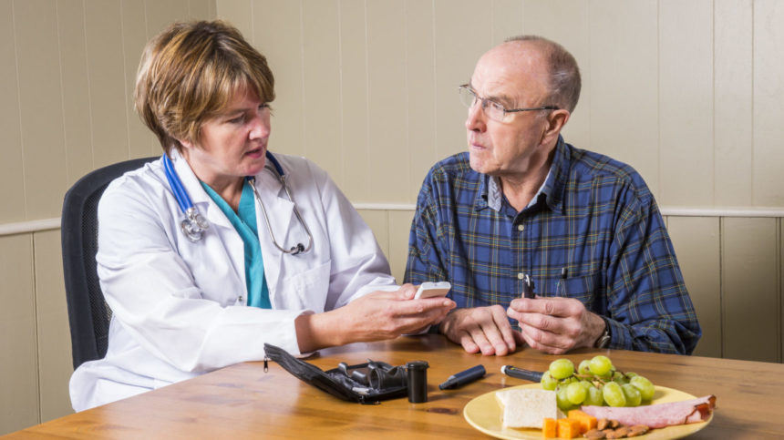 Image of a clinician advising a patient about diabetes care.
