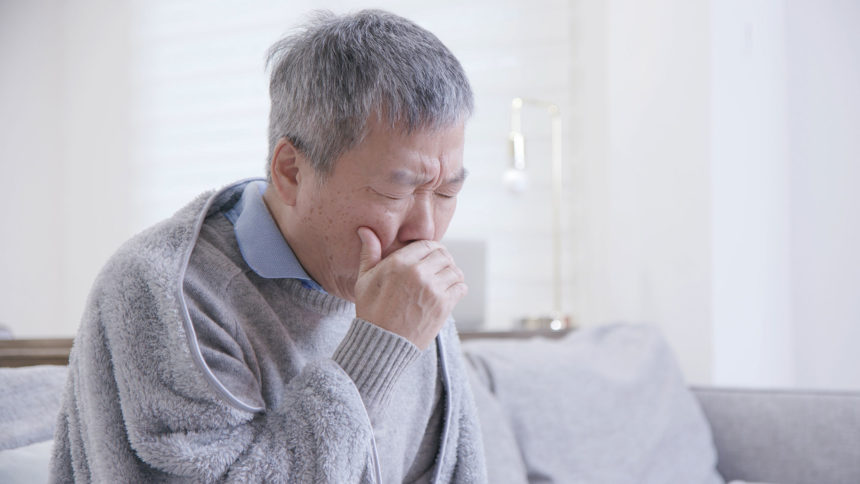 Image of senior man coughing