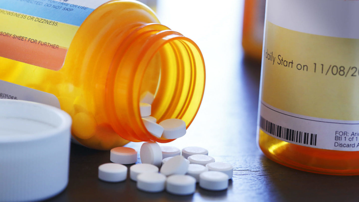 Close Up Of Pills Pouring Out Of A Prescription Medication Bottle; Image credit: Getty Images