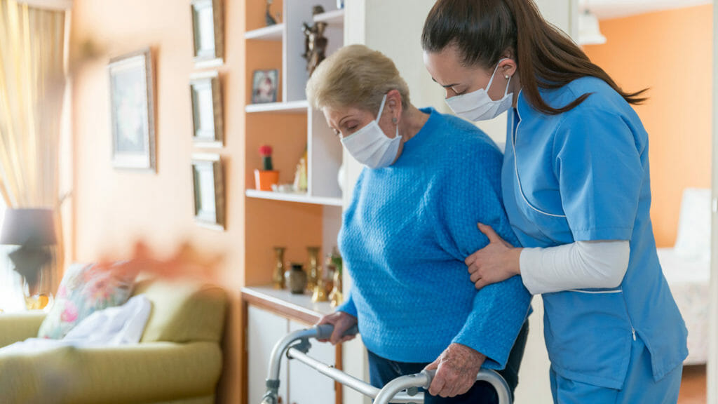 Nursing home worker cares for a resident