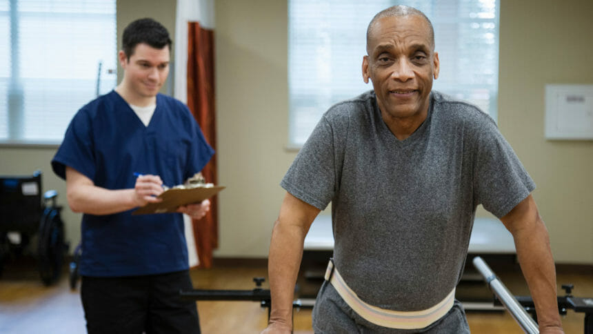 Man practicing walking during physical therapy