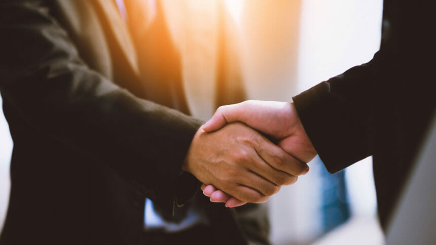 Executives share a handshake