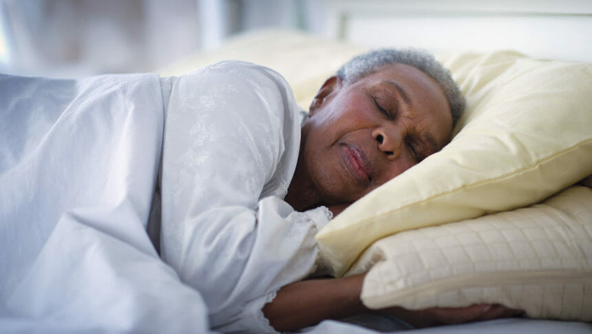 Closeup of older woman sleeping in bed