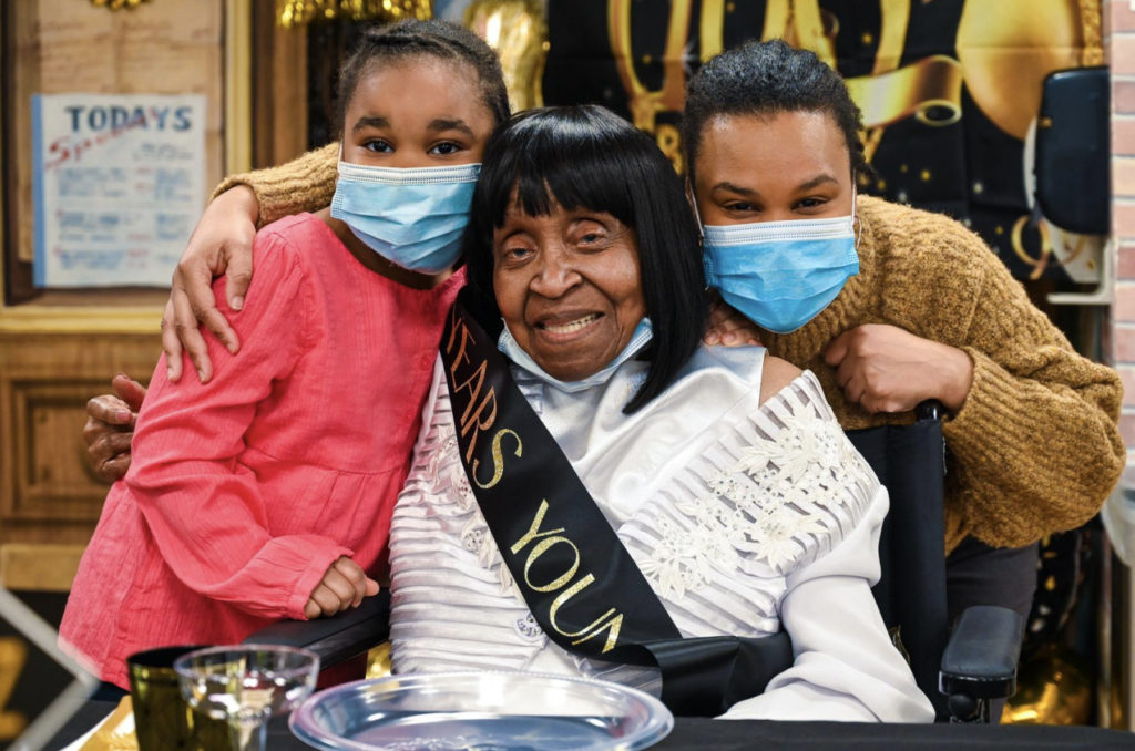 Gloria Hunt (center) celebrates her 101st birthday with her granddaughter and great-granddaughter