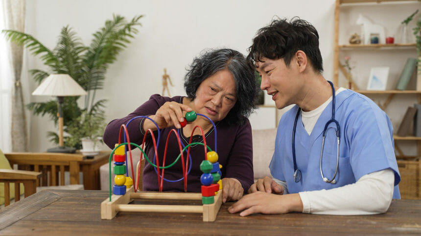 A caregiver helping a nursing home resident
