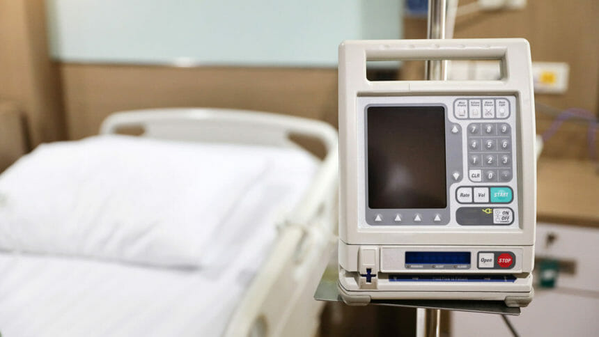 dialysis machine with bed in hospital background