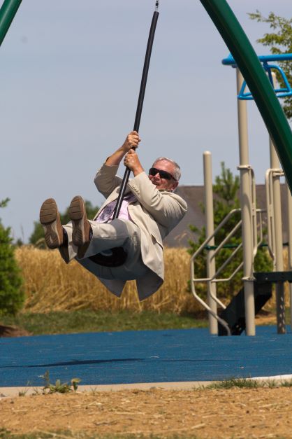 CEO Jeff Shireman rides the zipline.
