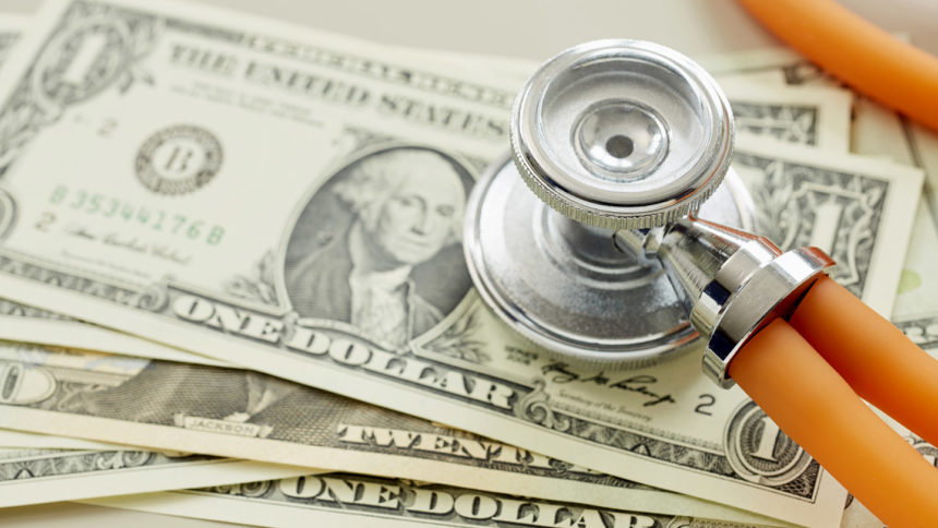 Close-up of American Dollar banknotes with stethoscope