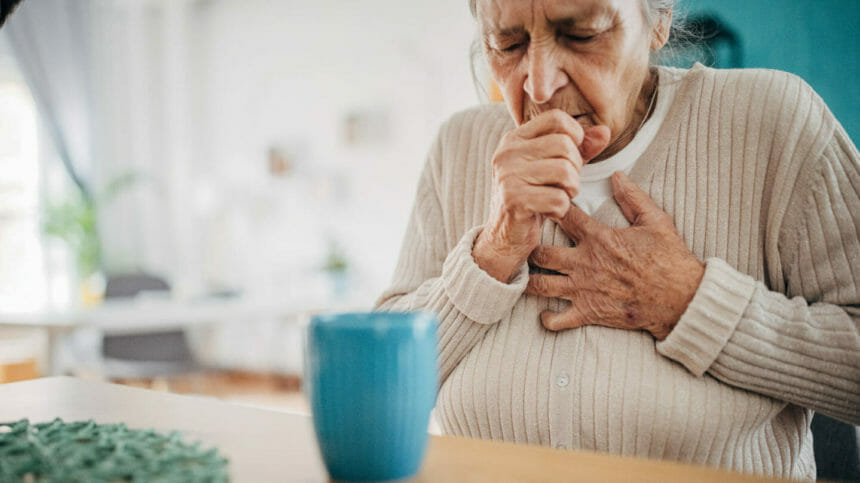 Older woman coughing
