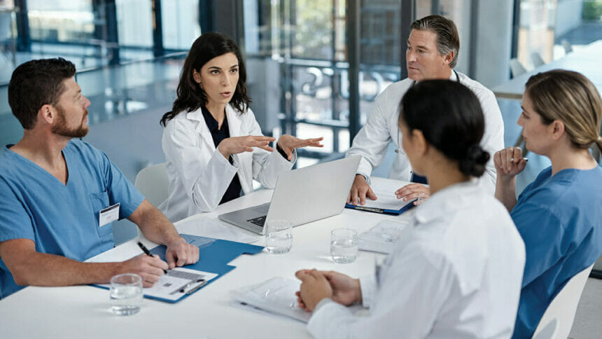 healthcare workers sitting around a table