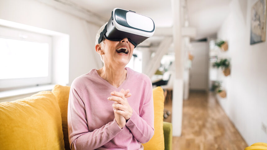 Old woman enjoying virtual reality simulator